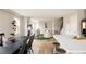 Bright open-concept living space with a modern kitchen and comfortable lounge area at 2134 S Galapago, Denver, CO 80223