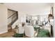 Bright and airy living room with open floor plan, hardwood floors, and modern staircase at 2134 S Galapago, Denver, CO 80223