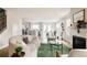 Spacious open-concept layout connects the living room, kitchen, and dining area seamlessly at 2134 S Galapago, Denver, CO 80223