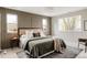 Serene main bedroom with paneled wall, neutral tones, and large windows at 2134 S Galapago, Denver, CO 80223