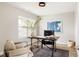 Well lit office with large window, desk, and comfortable chairs at 2134 S Galapago, Denver, CO 80223