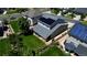 A charming gray two-story home with solar panels and a well-manicured lawn in a quiet neighborhood at 26072 E Fremont Pl, Aurora, CO 80016