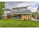Expansive backyard featuring a covered patio and mature trees at 26072 E Fremont Pl, Aurora, CO 80016
