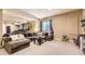 Spacious finished basement featuring plush carpeting and an inviting sectional couch at 26072 E Fremont Pl, Aurora, CO 80016