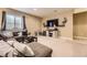 Inviting finished basement area featuring comfortable seating and entertainment center at 26072 E Fremont Pl, Aurora, CO 80016
