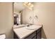 Bathroom featuring modern vanity, ample lighting, and a sleek design at 26072 E Fremont Pl, Aurora, CO 80016