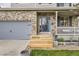Close-up of the home's front entrance showcasing the address, brick detail, and modern porch at 26072 E Fremont Pl, Aurora, CO 80016