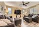 Comfortable living room with a ceiling fan, hardwood floors, and contemporary furniture for relaxing and entertaining at 26072 E Fremont Pl, Aurora, CO 80016