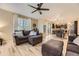 Open living space features hardwood floors, neutral paint, and furniture for Gathering gatherings and entertainment at 26072 E Fremont Pl, Aurora, CO 80016