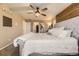 Bright main bedroom features an accent wall, ceiling fan, carpet flooring and plenty of storage space at 26072 E Fremont Pl, Aurora, CO 80016