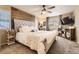 Main bedroom with an accent wall, ceiling fan, carpet flooring and lots of natural light at 26072 E Fremont Pl, Aurora, CO 80016