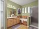 Well-lit bathroom showcasing a double vanity, soaking tub, and a separate shower for a spa-like experience at 7651 E 26Th Ave, Denver, CO 80238