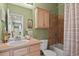Functional bathroom with vanity, tub, and shower, offering essential amenities in a cozy space at 7651 E 26Th Ave, Denver, CO 80238