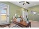 Bright home office/bedroom with desk, decor, ceiling fan, and natural light at 7651 E 26Th Ave, Denver, CO 80238