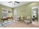 Home office/bedroom with desk, decor, ceiling fan, and natural light at 7651 E 26Th Ave, Denver, CO 80238