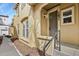 Inviting front entrance features a modern door, large windows, and stylish architectural details at 7651 E 26Th Ave, Denver, CO 80238