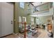 Open-concept living room with high ceilings and lots of natural light flowing through many windows at 7651 E 26Th Ave, Denver, CO 80238