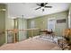 Cozy loft area with a workspace, offering a peaceful retreat with views of the living space below at 7651 E 26Th Ave, Denver, CO 80238
