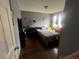 Bedroom with hardwood floors, decorated walls, and natural light at 5129 Chandler Way, Denver, CO 80239