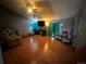 Spacious living room with hardwood floors, comfortable seating, and a ceiling fan at 5129 Chandler Way, Denver, CO 80239