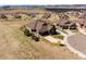 Stunning aerial view of the home with an attached garage and a well-manicured lawn on a quiet cul-de-sac at 16406 W 85Th Ln # A, Arvada, CO 80007