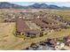 Panoramic aerial view of homes in the neighborhood, displaying private balconies and mountain views at 16406 W 85Th Ln # A, Arvada, CO 80007