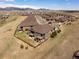 Scenic aerial view of the neighborhood and home, featuring private balconies and a fenced backyard at 16406 W 85Th Ln # A, Arvada, CO 80007