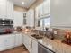 Well-equipped kitchen with granite countertops, stainless steel appliances, and lots of natural light at 16406 W 85Th Ln # A, Arvada, CO 80007
