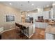 Modern kitchen with white cabinets, stainless steel appliances, and a granite-topped center island at 16406 W 85Th Ln # A, Arvada, CO 80007