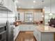 Stylish kitchen with white cabinetry, stainless steel appliances, and a bright, airy feel at 16406 W 85Th Ln # A, Arvada, CO 80007