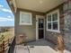 Covered front patio featuring brick and stone accents at 16406 W 85Th Ln # A, Arvada, CO 80007