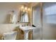 Cozy bathroom featuring stand up shower, pedestal sink, and tile wall at 2870 Jasmine St, Denver, CO 80207
