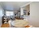 Open dining area with hardwood floors that flow into a living room at 2870 Jasmine St, Denver, CO 80207