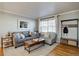 Inviting living room with hardwood floors, natural light, and modern decor at 2870 Jasmine St, Denver, CO 80207