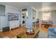 Cozy living room with hardwood floors, washer dryer, and adjacent dining area at 2870 Jasmine St, Denver, CO 80207