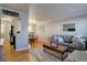 Bright living room with hardwood floors, comfortable seating, and stylish decor at 2870 Jasmine St, Denver, CO 80207