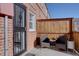 Private patio featuring a cozy seating area with two chairs and small table at 2870 Jasmine St, Denver, CO 80207