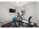 Workout room featuring exercise bike, elliptical, yoga ball, and wall-mounted television at 604 S Yarrow St, Lakewood, CO 80226