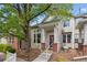 Inviting exterior showcasing a charming two-story home with manicured landscaping and a quaint front porch at 604 S Yarrow St, Lakewood, CO 80226