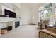 Inviting living room boasting a fireplace, ample space, and large windows for abundant sunlight at 604 S Yarrow St, Lakewood, CO 80226