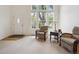 Bright living area featuring large windows, natural light, and a comfortable seating area at 604 S Yarrow St, Lakewood, CO 80226