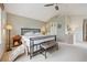 Main bedroom with vaulted ceiling, windows and a metal frame bed at 604 S Yarrow St, Lakewood, CO 80226