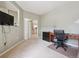 Comfortable office space featuring neutral tones, functional layout, and seamless transition to living areas at 604 S Yarrow St, Lakewood, CO 80226