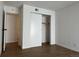 Bedroom featuring hardwood flooring, natural light and a sliding closet door at 943 S Zeno Way # 205, Aurora, CO 80017