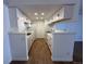 Spacious kitchen with white cabinetry, marble countertops, and modern appliances at 943 S Zeno Way # 205, Aurora, CO 80017