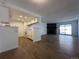 Open concept living area with a kitchen, fireplace, and sliding glass doors to the patio at 943 S Zeno Way # 205, Aurora, CO 80017