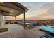 Outdoor living on a spacious deck featuring an above-ground pool and hot tub at 3234 Picketwire Way, Castle Rock, CO 80108