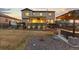 Spacious backyard featuring a hot tub, outdoor seating, and manicured landscaping at 3234 Picketwire Way, Castle Rock, CO 80108