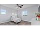 Bright bedroom with light gray walls, white trim, light laminate flooring, and lots of natural light at 3234 Picketwire Way, Castle Rock, CO 80108