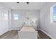 Bright bedroom with light gray walls, white trim, light laminate flooring, and lots of natural light at 3234 Picketwire Way, Castle Rock, CO 80108